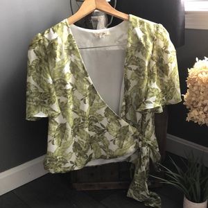 Woman’s size M wrap around tie green print shirt